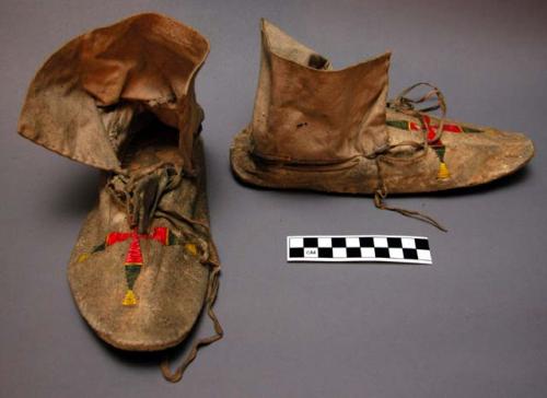 Pair of Plains quilled moccasins, possibly Sioux. 1 sole made from parfleche.