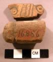 Fragments pottery, sinkers?