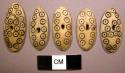Ivory buttons with incised circle motif