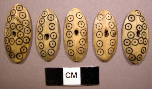 Ivory buttons with incised circle motif