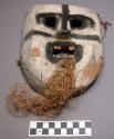 Carved wooden mask for dance - root attached for beard.  Linongo