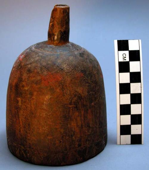 Wooden funnel used for pouring liquid into small opening