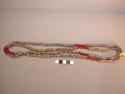 Double strand string of shell beads with red glass beads