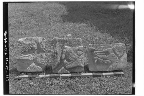 Three relief tiger heads from around southeast annex at Monjas.