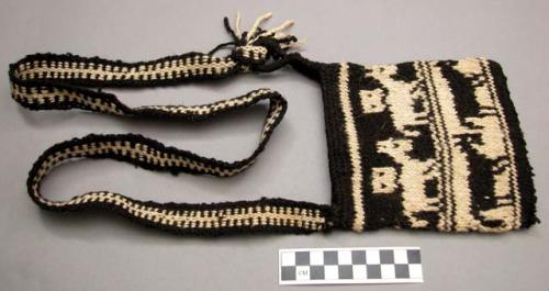 Small black and white bag - these are knitted by the men as they walk from place