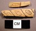 Bone fragments with incised geometric designs