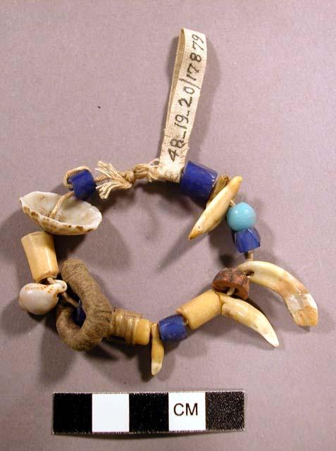 Child's necklace to keep off evil - glass beads and teeth