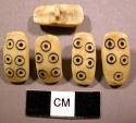 Ivory buttons with incised circle motif