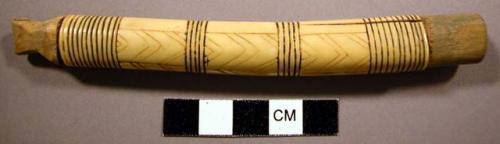 Needle case, tubular bone or ivory, incised & pigmented geomteric design