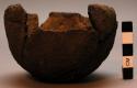 Small bowls or cups of brown mud