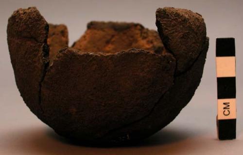 Small bowls or cups of brown mud