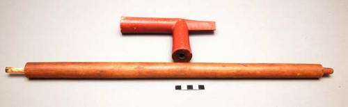 Pipe stem with undecorated wood stem.