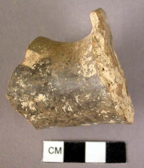 Fragment of a shortened pottery side spout