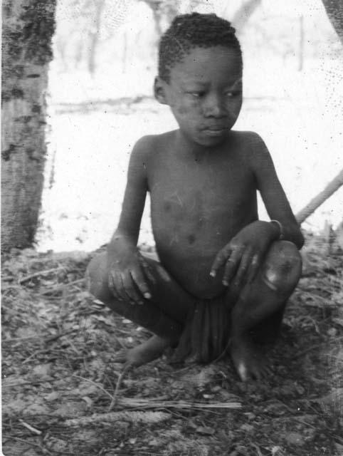 Dicolo (son of _Tao and Tshombe) sitting