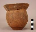 Small pottery jar with flaring rim- restored