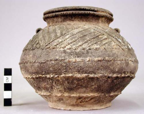 Pottery vessel, with raised decorations