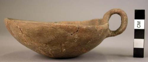 Pottery bowl-cup with over-looped handle