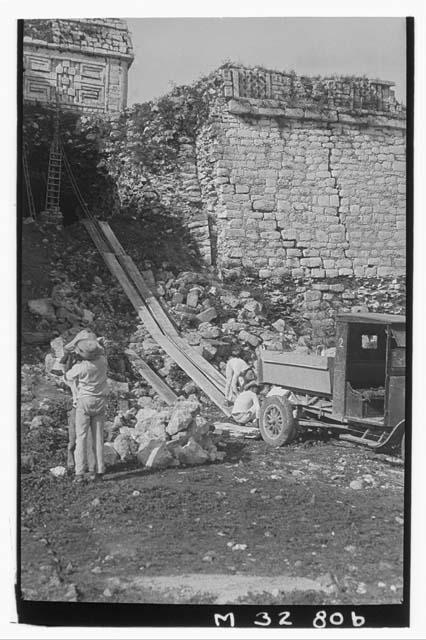 Monjas, repair work on cave. Ford being used to haul capstones into cave.