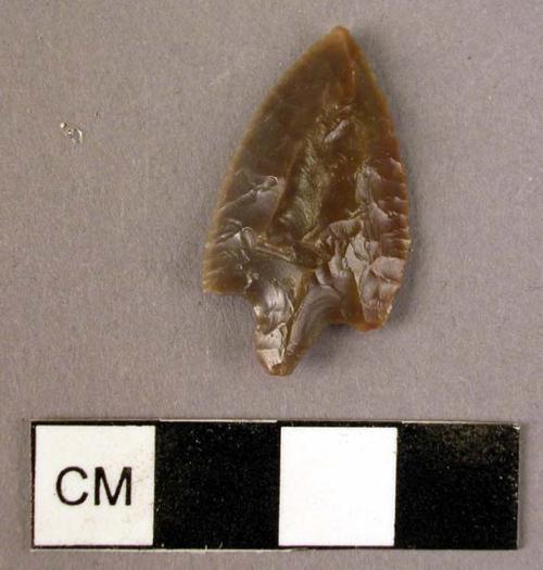Flint projectile point; basal notched; unifacially worked except for stem which