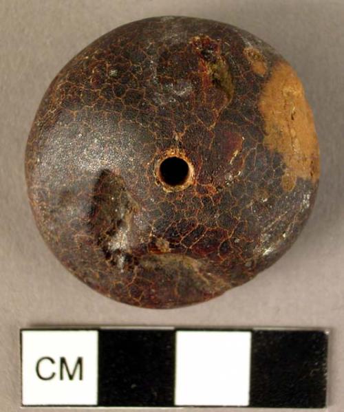 Disk-shaped amber pendant