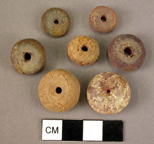 Disk-shaped amber beads of various sizes