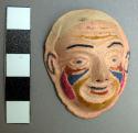 Miniature plaster mask - human face, painted decoration on face in +