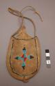 Skin bag with bead decoration