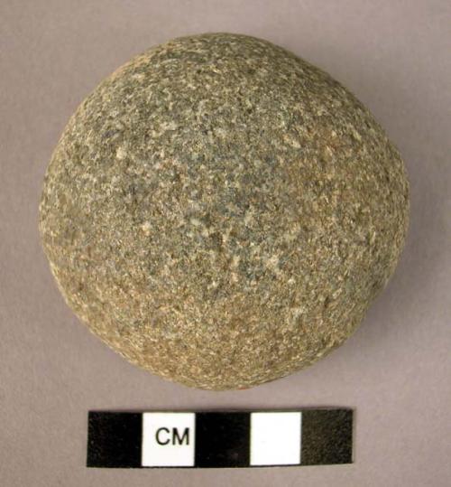 Fragment of an irregular, partially smoothed stone ball