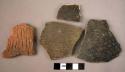 7 black-reddish incised and cord-marked ware sherds