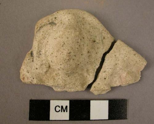 Buddha relief fragment; head only; lime plaster.