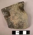 Handled potsherd - gray buff slip, polished