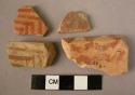 Ceramic rim and body sherds, red ware w. red painted linear designs