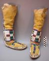 Pair of Arapaho woman's boots. Rawhide soles & buckskin uppers. Beadwork