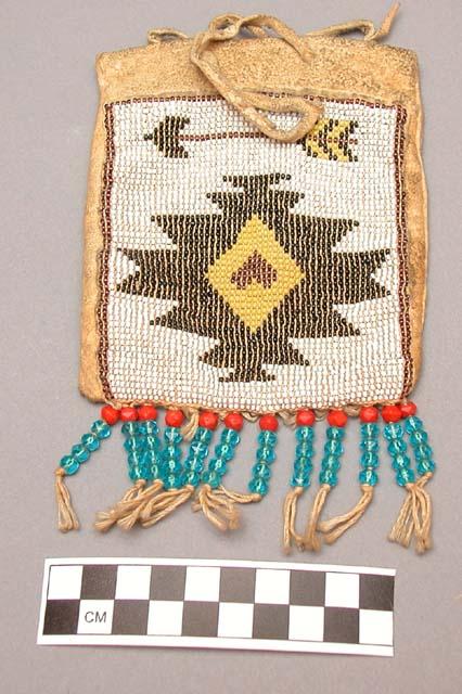 Skin pouch with bead decoration and fringe of glass beads