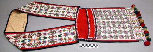 Beaded cloth shoulder pouch with tassels