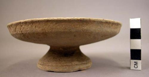 Small pedestalled pottery dish