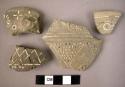 19 sherds (grey and Black/gray. Incised white filled ware)
