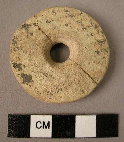 Ceramic spindle whorl, made on a sherd, discoidal