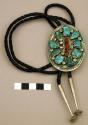 Silver bolo, oval, stamped silver designs inlaid with turquoise and coral