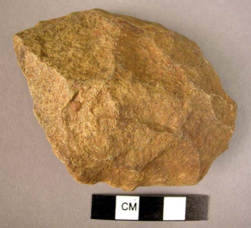 Thick, oval-shaped quartzite flake implement