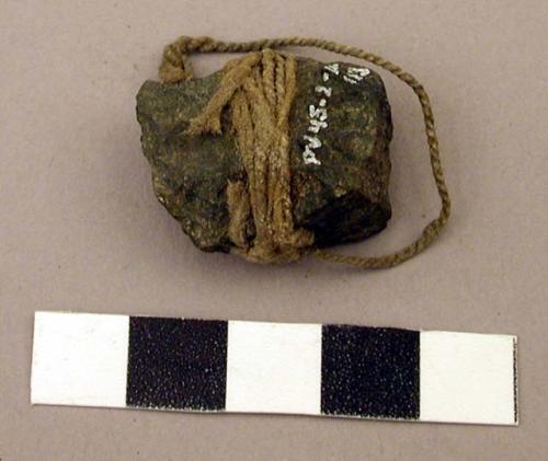 Raw material, unmodified rock tied with twine