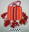 Tapestry bag, wool, trimmed with four large tassels. narrow verical bands of whi
