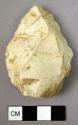 Triangular flint point, worked on both faces, rather thick in section