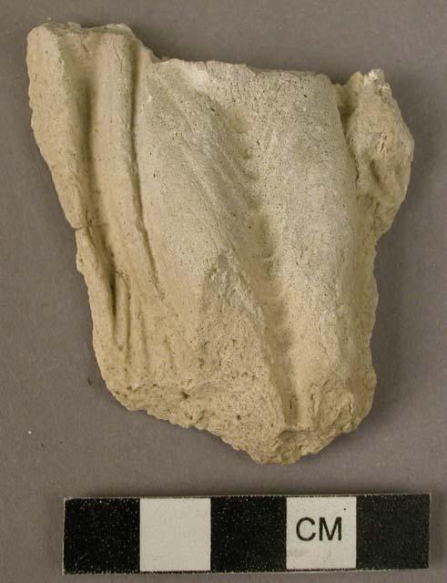 Lower half of buddha figure of plaster - 2" high, feet missing