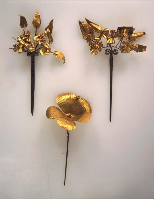 Gold flower worn in the head cloth or turban by a Kebijar dancer