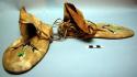 Pair of plains moccasins, possibly Sioux. Hard soles. Leather uppers