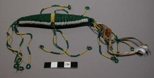 Sioux navel amulet. Cylindrical shape w/ tapering ends, possibly representing an