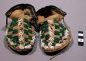 One pair of children's moccasins--skin with rawhide soles; beaded top
