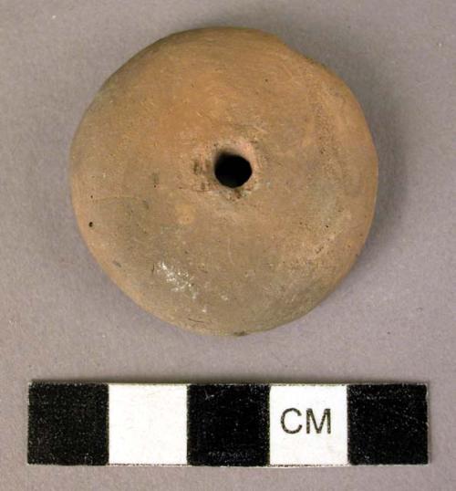 Baked clay spindle whorl