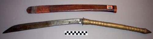Sacrificial sword with wooden sheath. Long, slightly curved metal blade